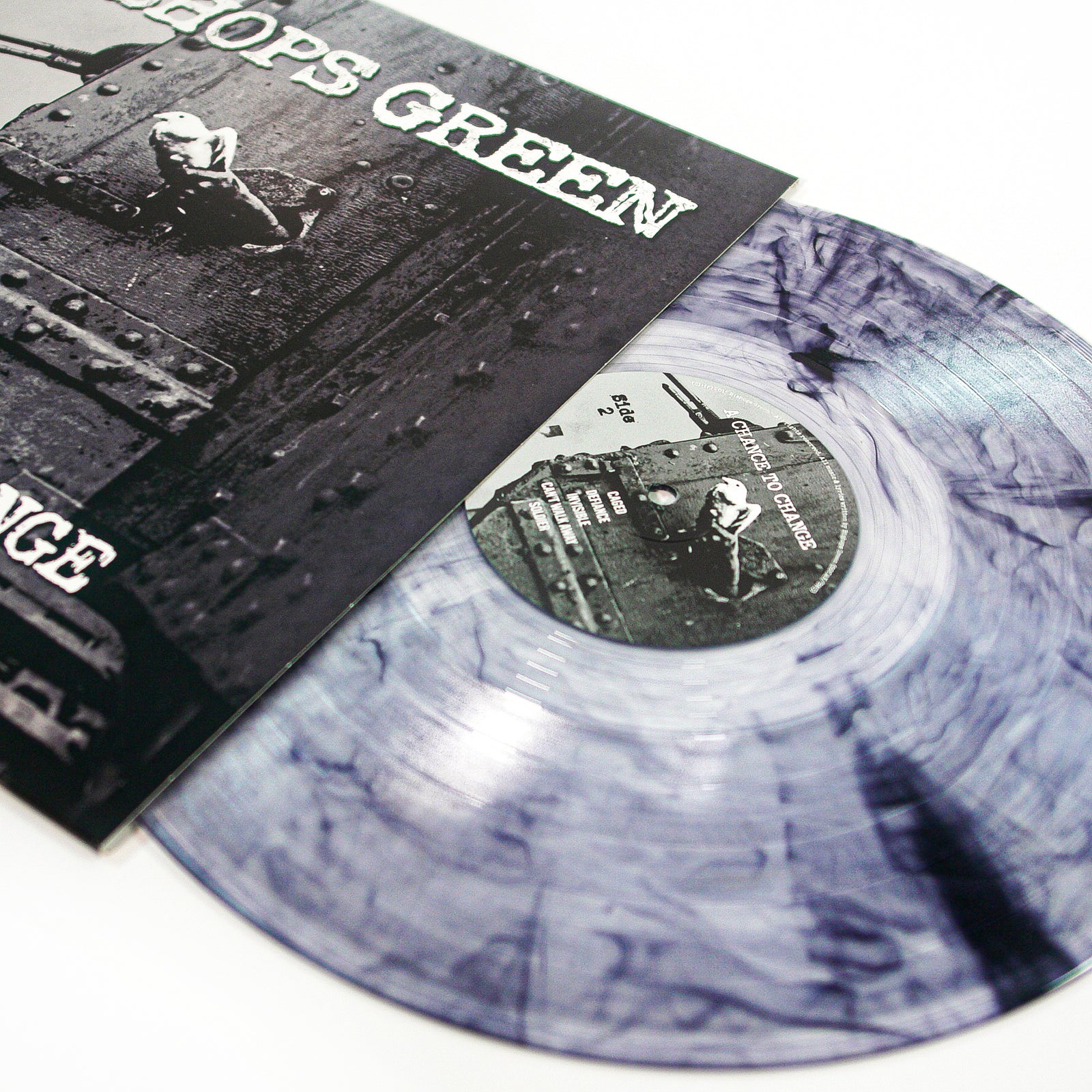 A marbled gray and white vinyl record slides from its black-and-white album cover with a bold CROPS GREEN title—an essential Bishops Green release for any punk rock or streetpunk fan.