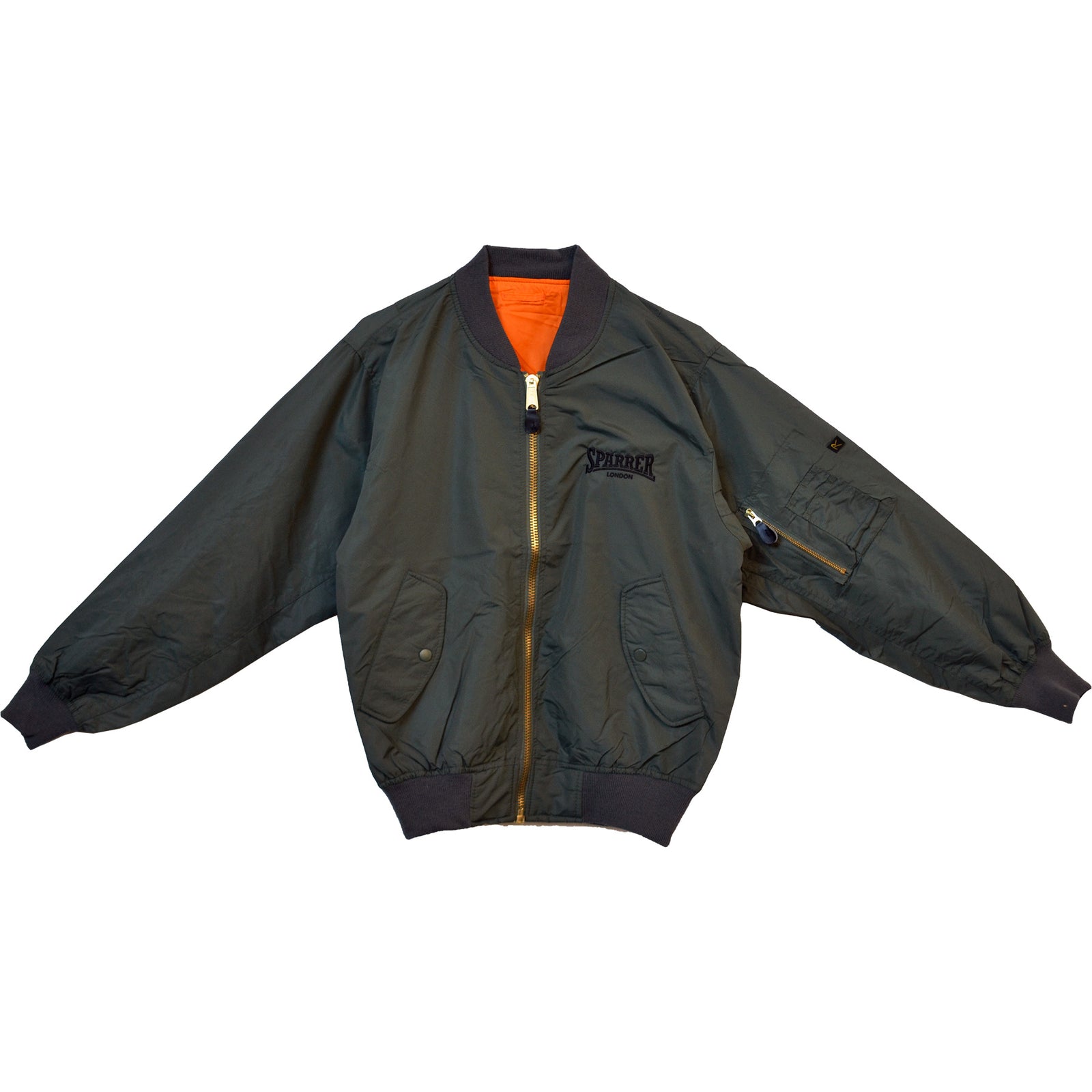 A dark green Cock Sparrer MA-1 flight jacket with front zipper, orange lining, ribbed cuffs and hem, two front pockets, zippered sleeve pocket, and SPIDER embroidered on the left chest.