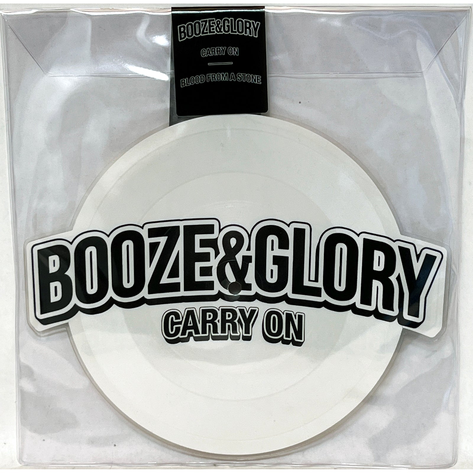 A limited edition white Carry On vinyl from Booze & Glory comes in a sleeve marked "BOOZE & GLORY - CARRY ON," peeking through clear packaging with "BLOOD FROM A STONE" on a small strip at the top.