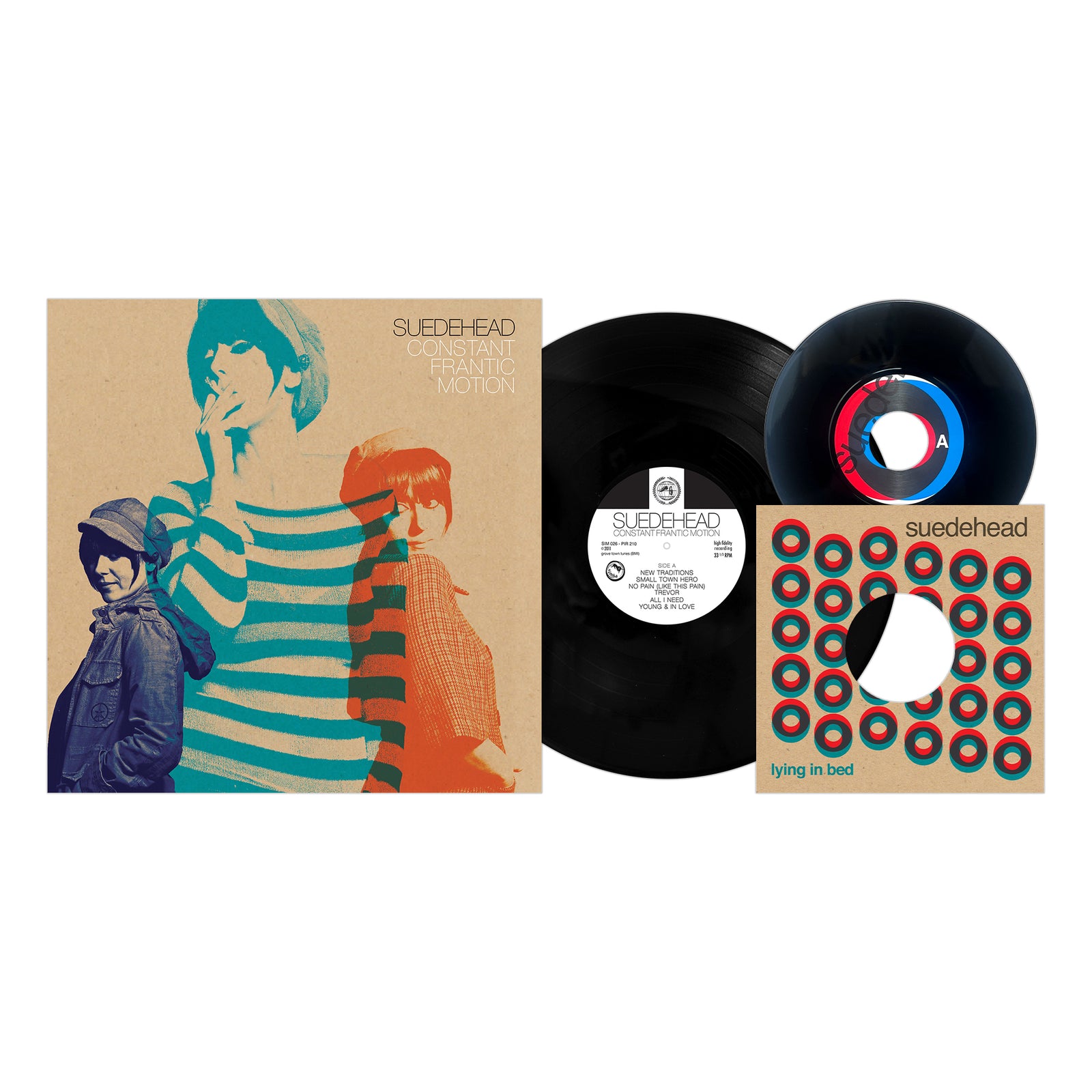 Vinyl records and cover art from Suedehead’s *Constant Frantic Motion* feature three individuals in vintage attire on the cover, reflecting the retro vibe inspired by Northern Soul and punk that defines Suedehead’s sound. A separate single titled “Lying in Bed” comes with its own patterned sleeve.