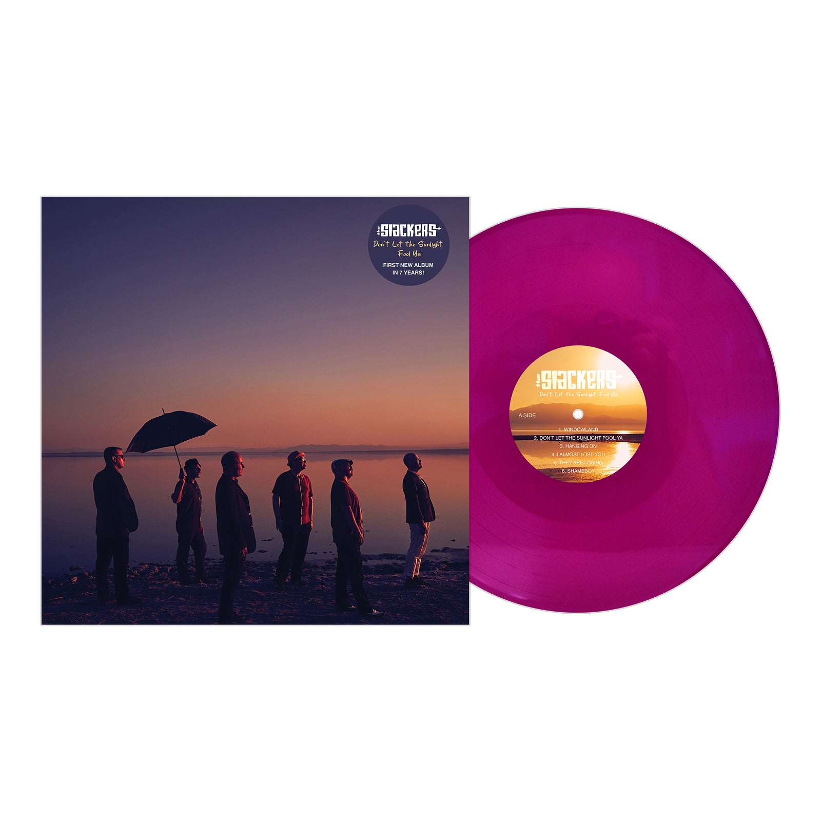 A purple vinyl record from The Slackers. Its cover depicts six people by waterfront at sunset, one with an umbrella. Text: The Slackers - Don’t Let The Sunlight Fool Ya, the new album from Pirates Press Records.