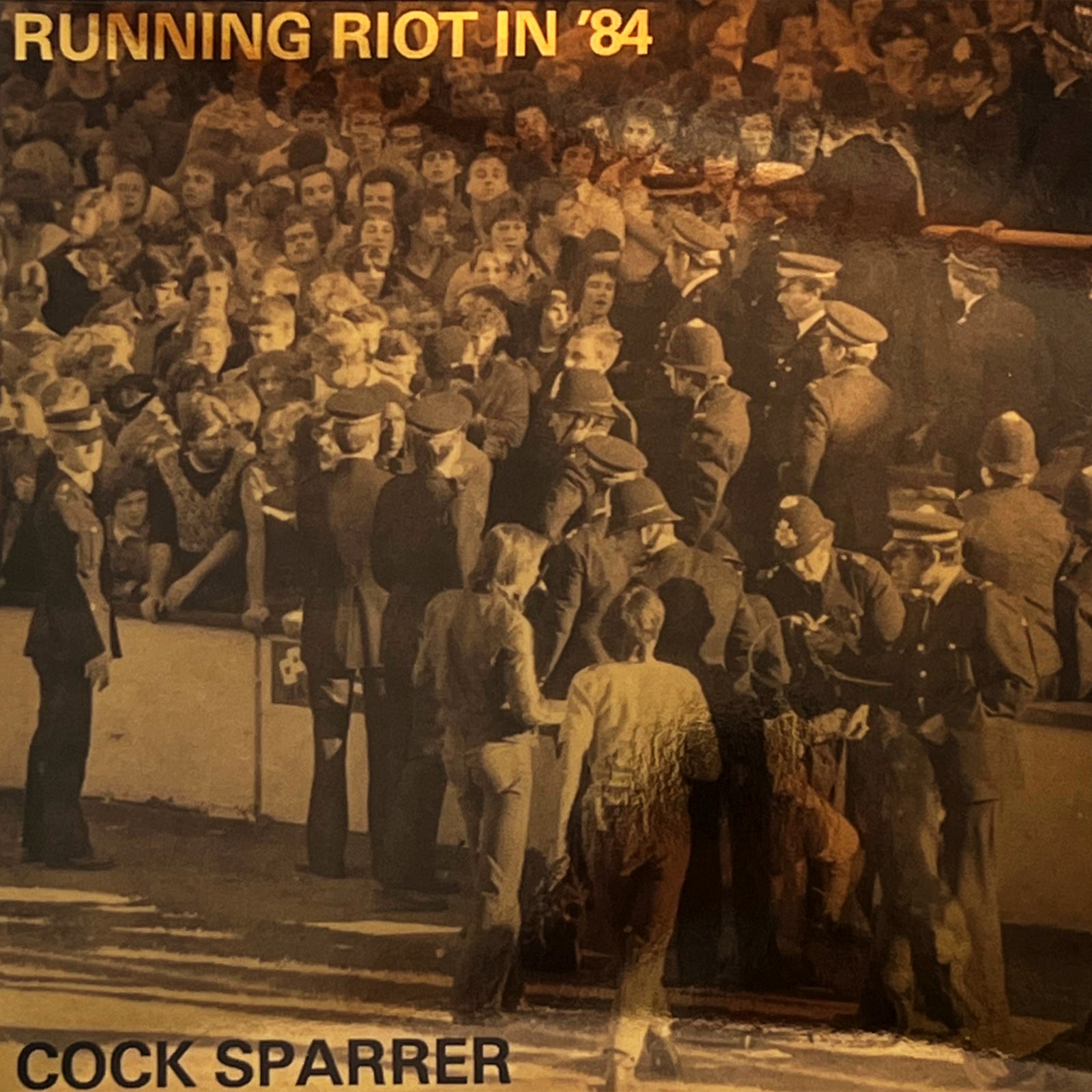 A sepia-toned photo shows a chaotic stadium clash, with RUNNING RIOT IN ’84 at the top and COCK SPARRER at the bottom—ideal for fans of Cock Sparrers 180 g black vinyl edition.