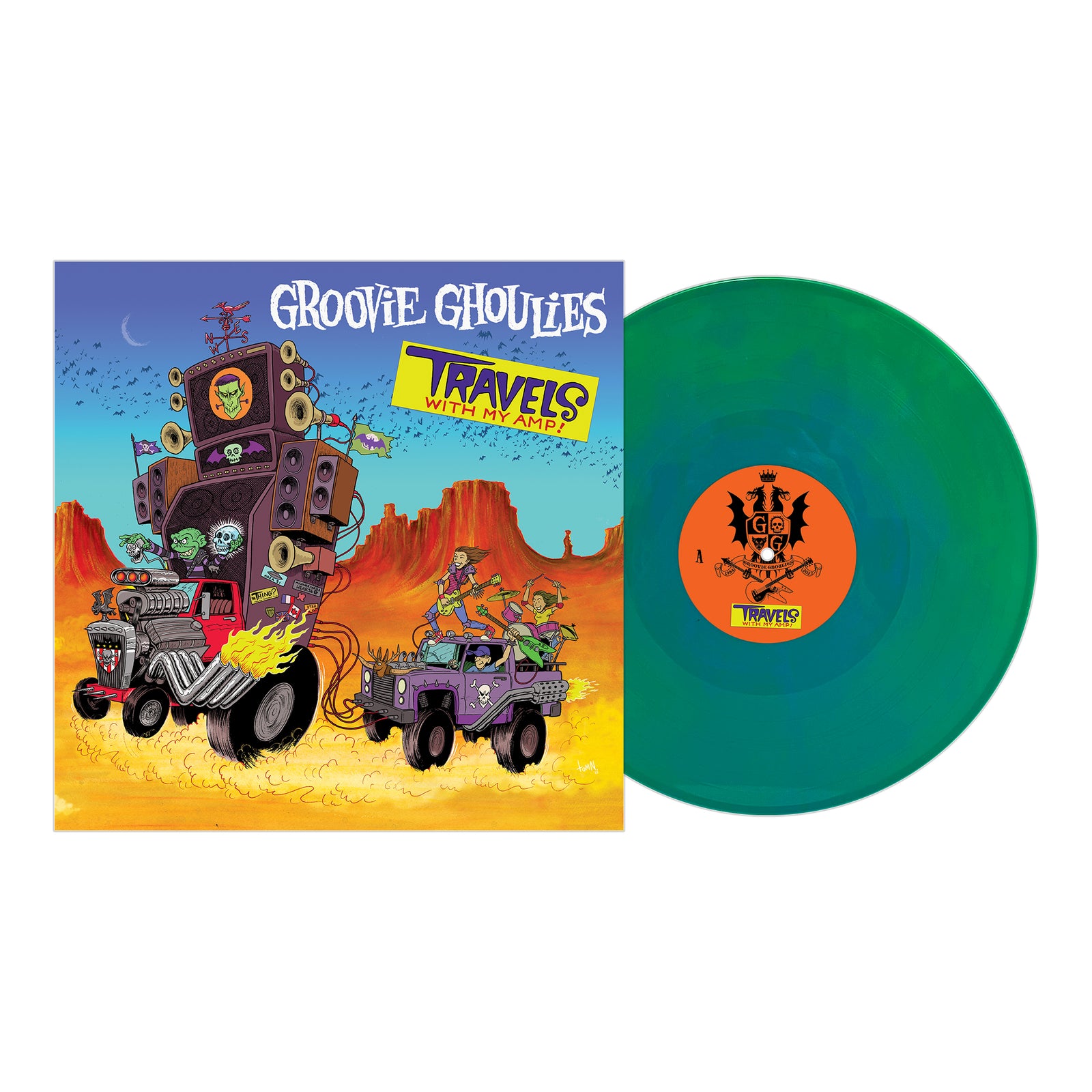 Groovie Ghoulies’ Travels With My Amp album cover shows cartoon monsters driving hot rods in a desert, plus a green vinyl record with an illustrated label next to the sleeve, capturing their musical journey.