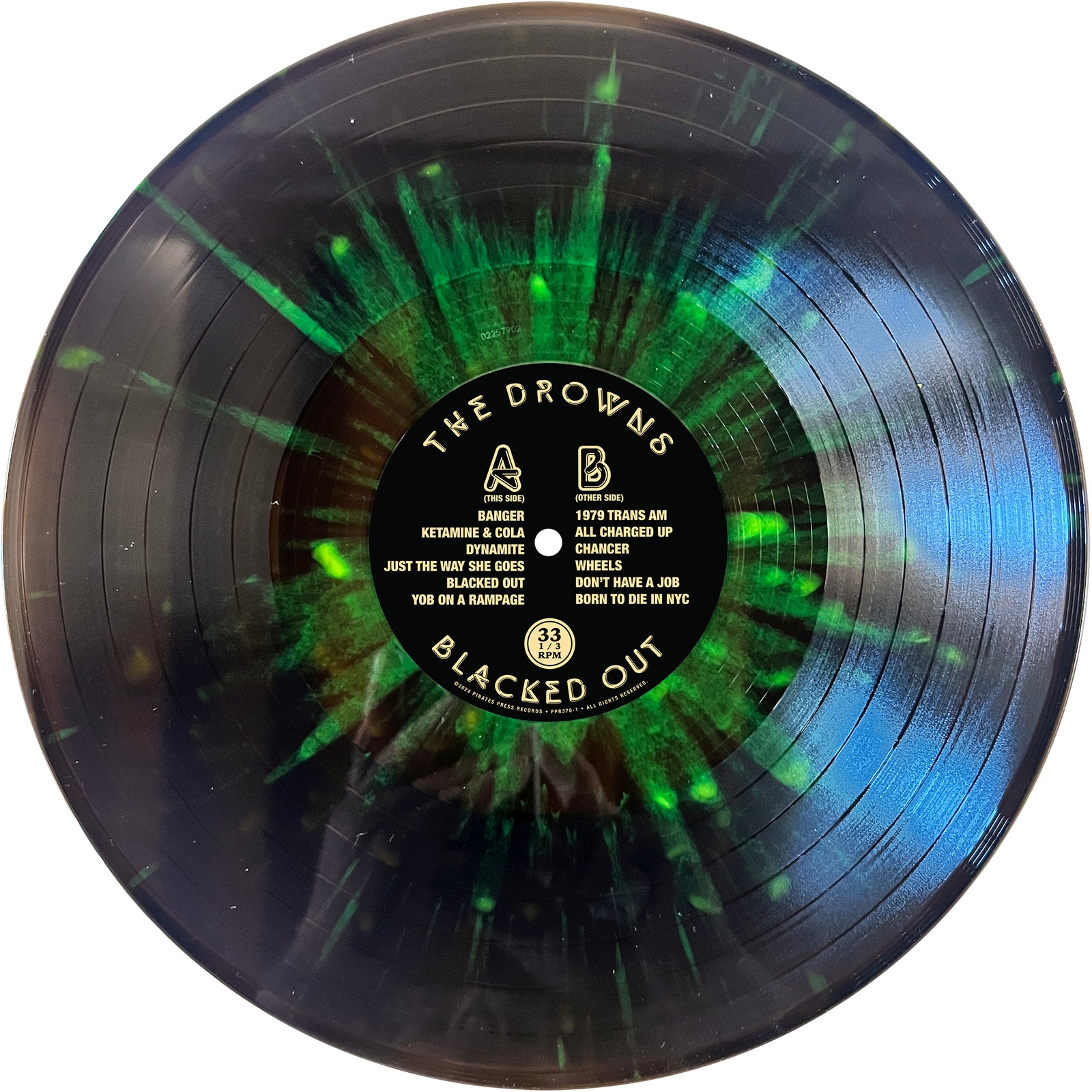 A black vinyl record by The Drowns features green splashes and a center label. Song titles and Sides A/B appear in white text, echoing the anthemic street punk style of this Seattle brand.