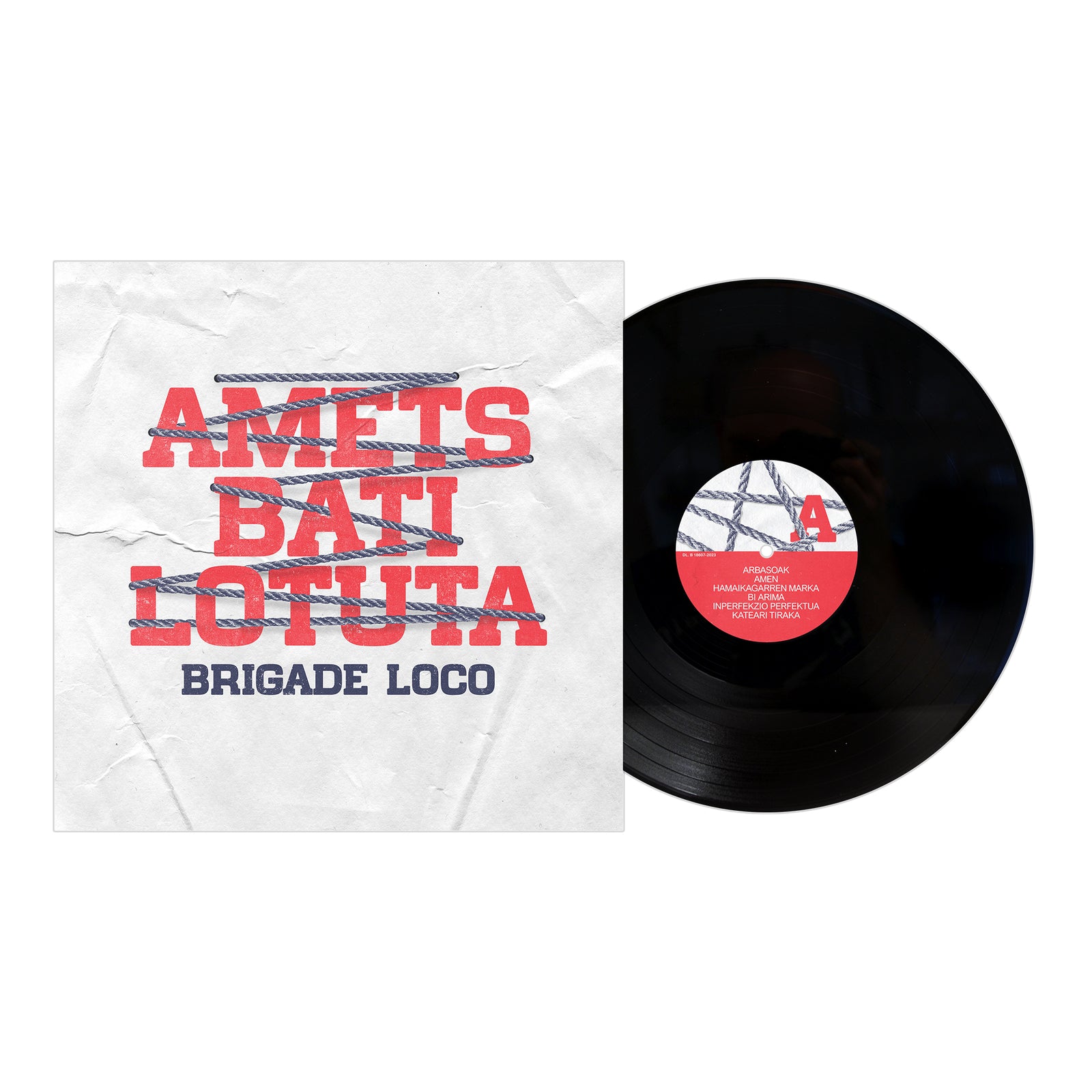 A vinyl record partially slides from its sleeve, which features AMETS BATI LOTUTA and Brigade Loco in bold red and blue on white with a chain design—iconic Basque punk style. The red vinyl label displays white text. Brand: Brigade Loco.