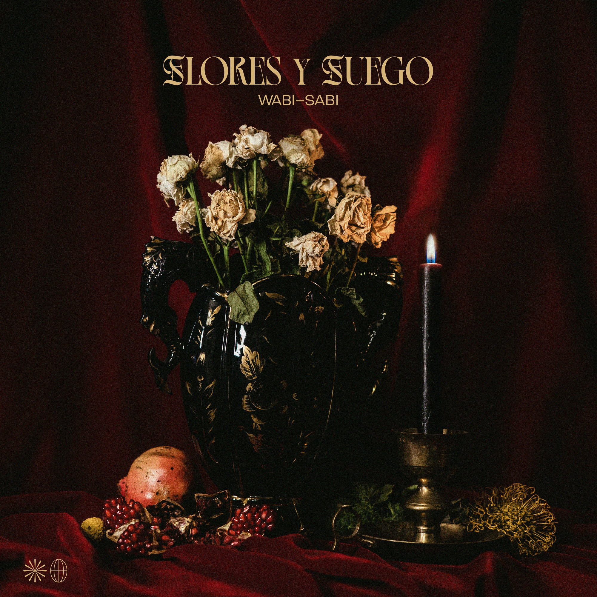 A moody still life of wilted flowers in a dark ornate vase, fruit, candle, and marigold on red cloth with deep red drapery. Above, the Flores Y Fuego brand name nods to “Wabi-Sabi” and hardcore punk from Pirates Press Records.