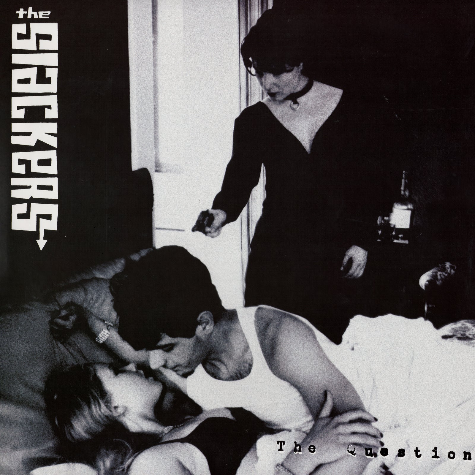 Black-and-white image of a woman and man embracing in bed, with another person standing nearby pointing a gun. Vertical text reads The Slackers, plus The Question—an iconic tribute from NYC ska/reggae legends, The Slackers.