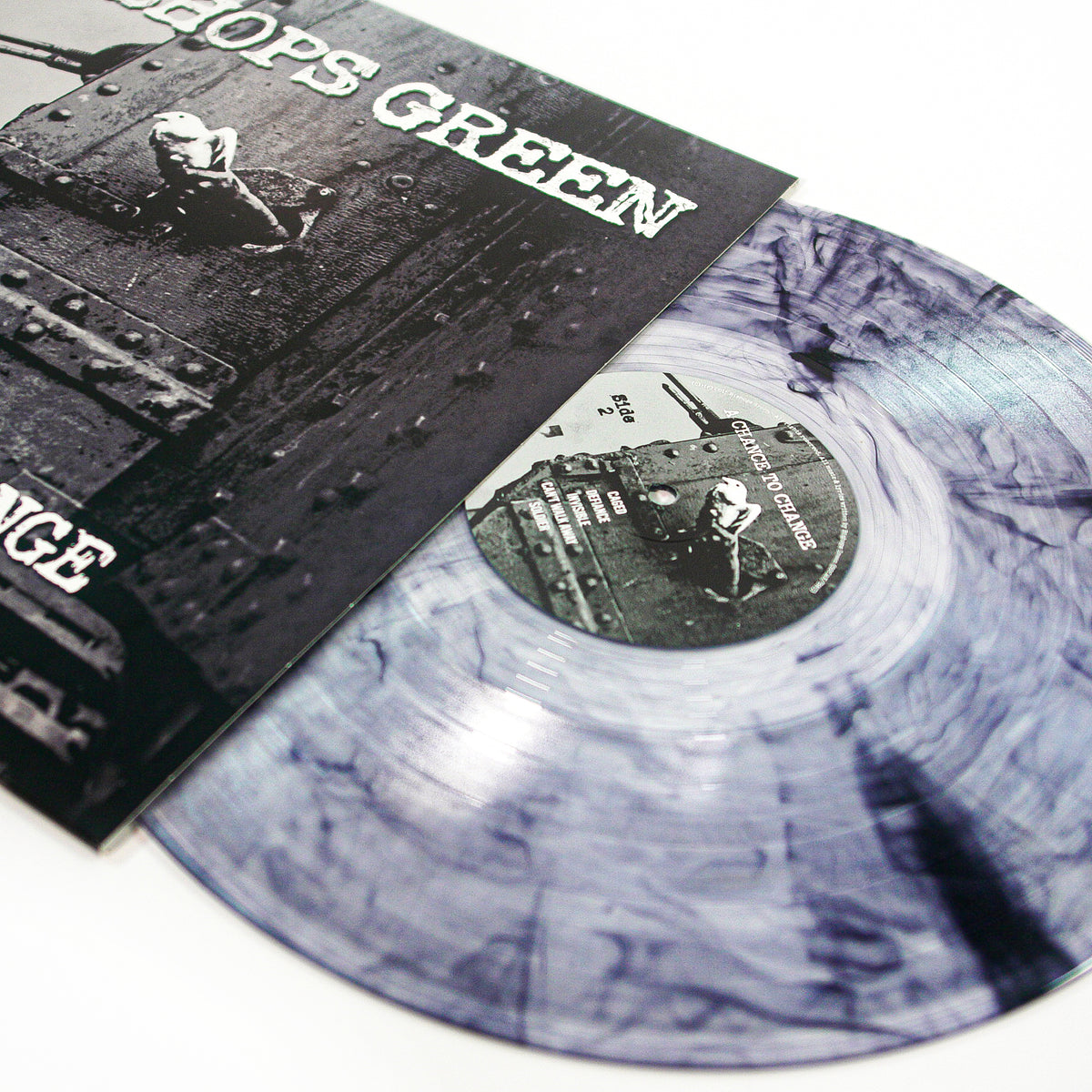 A marbled gray and white vinyl record slides from its black-and-white album cover with a bold CROPS GREEN title—an essential Bishops Green release for any punk rock or streetpunk fan.