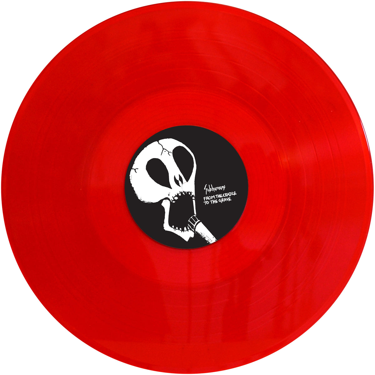A bright red Subhumans vinyl LP with a black center label featuring a white abstract skull and the text From The Cradle To The Grave.
