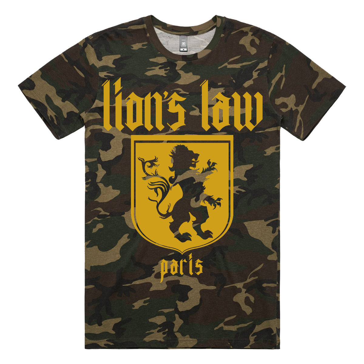 This Lion&#39;s Law 100% cotton camo t-shirt showcases a gold heraldic lion in a shield, &quot;Lion&#39;s Law&quot; in bold Gothic letters above, and &quot;Paris&quot; below, offering a distinctive urban style.