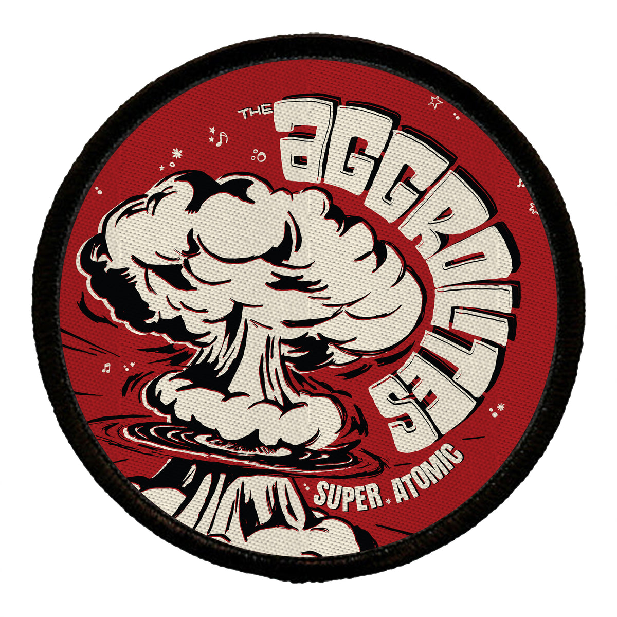 A woven patch features The Aggrolites brand with a bold white atomic explosion on a red background. "Super Atomic" appears smaller at the bottom, surrounded by musical notes and stars.