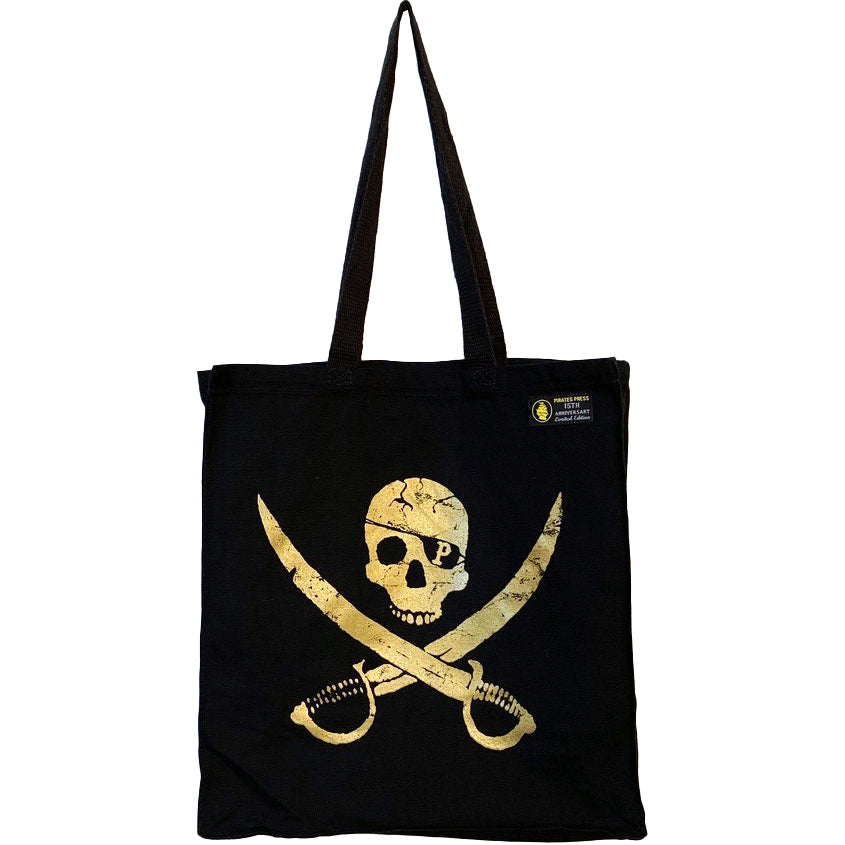 A black Pirates Press Records tote featuring a yellow skull and crossbones with crossed swords, two handles, and a small label in the top corner. Made from canvas, this shopper bag sports a bold pirate logo design.