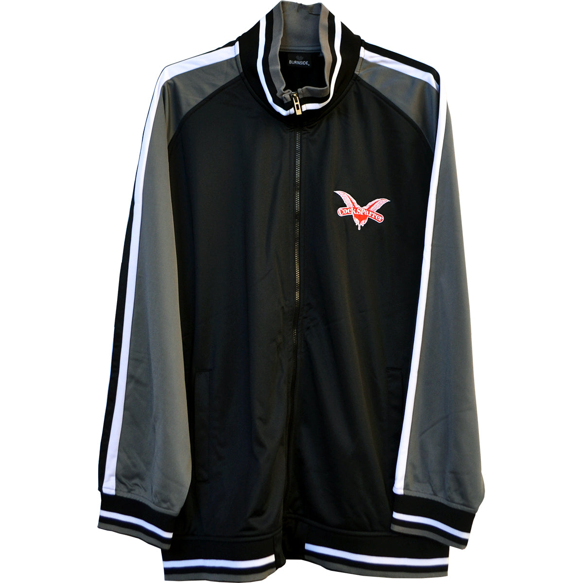 Black and gray Cock Sparrer Zip Track Jacket featuring white sleeve stripes, a red embroidered eagle logo with West Haven text on the left chest, high collar, ribbed cuffs, and a stylish wings design for extra flair.