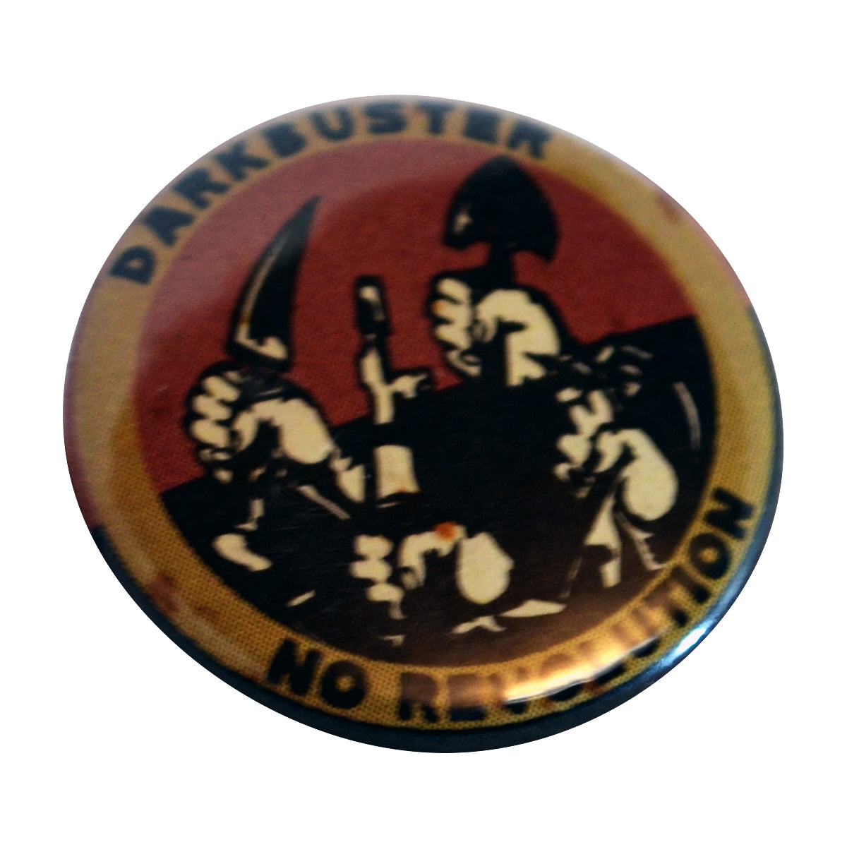 A circular button with &quot;The New Darkbuster&quot; at the top and &quot;NO REVOLUTION&quot; below, showing raised fists holding a bottle, knife, and spade on a dark background—ideal for fans of The New Darkbuster’s rebellious spirit.