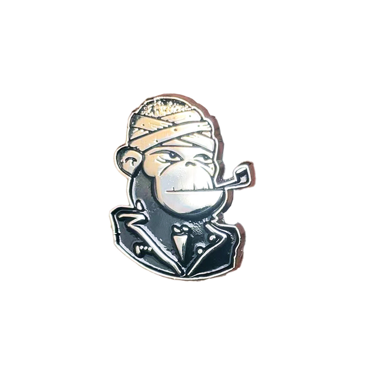 DeeCracks enamel pin featuring a cartoon monkey in a bandana and jacket, smoking a pipe, on a white background.