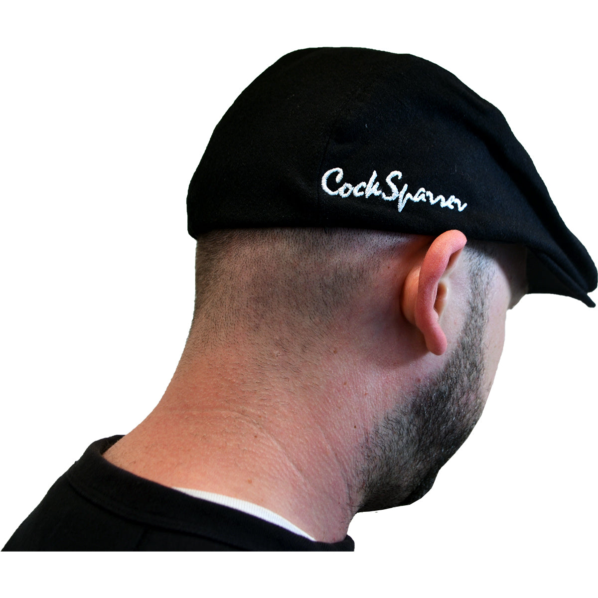 Someone wearing a Cock Sparrer black scally cap with the band&#39;s logo embroidered in white on the side, viewed from behind against a white background.
