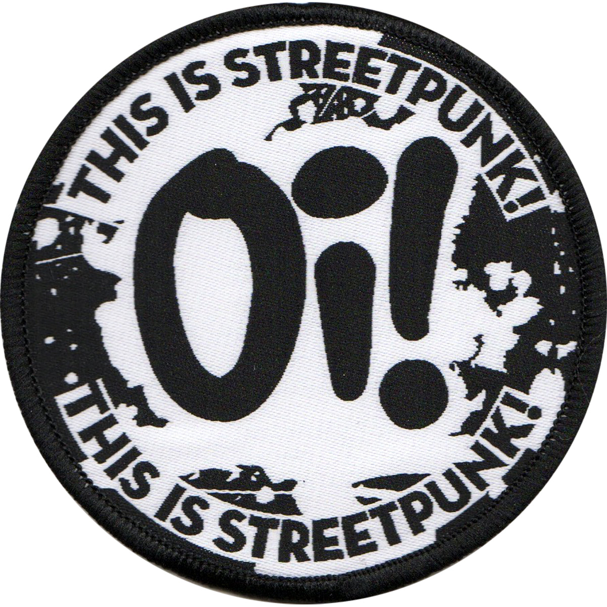 A 3 round black and white woven patch by Pirates Press Records with bold Oi! at the center and “THIS IS STREETPUNK!” on the top and bottom over a distressed background.