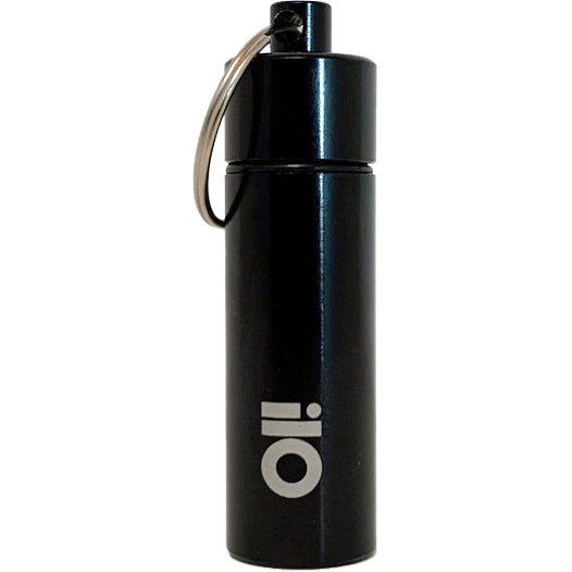 A black cylindrical ear plug case with a metal keyring and "Pirates Press Records" printed in white on the front—perfect as a handy pill case for travel.