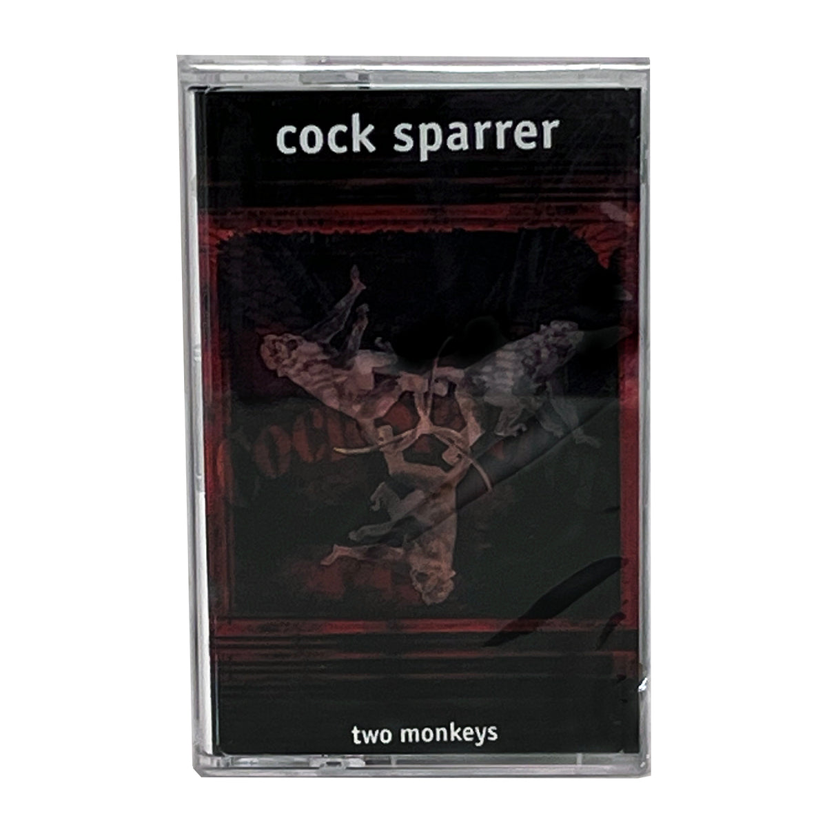 A cassette tape of Cock Sparrer’s Two Monkeys album, featuring a dark cover with an abstract design and the band name at the top—an iconic piece from these 1990s punk rock legends.