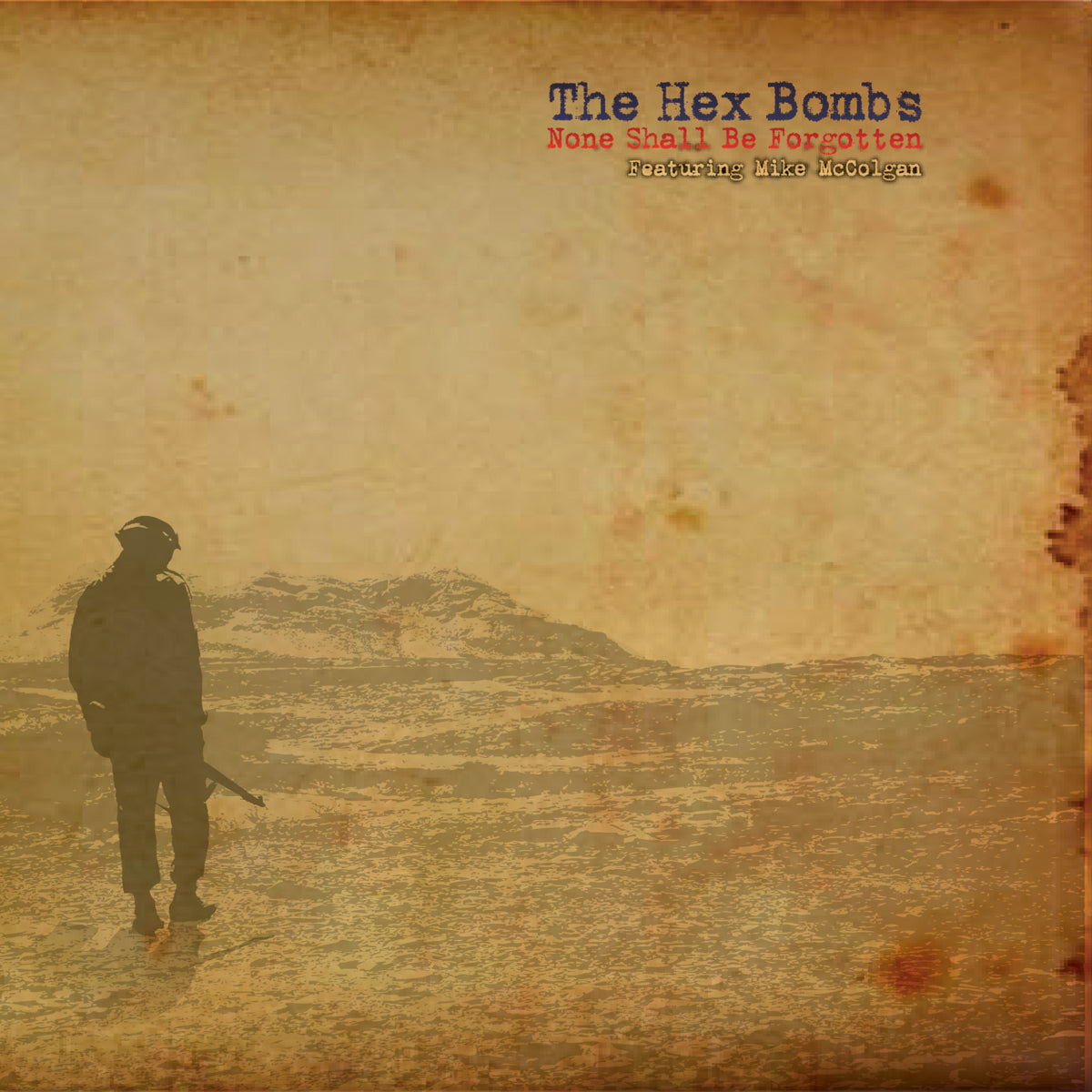 A lone soldier with a rifle stands on rough, sepia-toned ground under an empty sky. Top right text reads: “Hex Bombs, Midwest punk, None Shall Be Forgotten, Featuring Mike McColgan.”.
