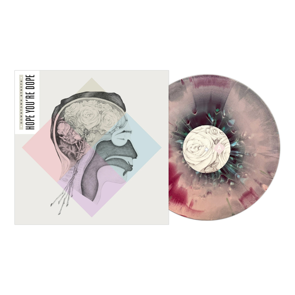 A Downtown Struts vinyl record with a swirling pink, black, and gray pattern sits by its album cover, which shows an anatomical side view of a human head filled with flowers—reflecting the band's new musical direction.