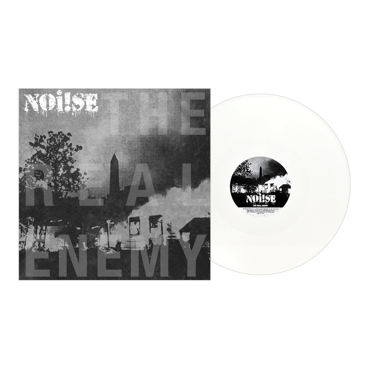 A white vinyl record by NOi!SE from Pirates Press Records sits next to its black-and-white cover, displaying NOi!SE and THE REAL ENEMY above a gritty urban scene with silhouettes of buildings and trees.