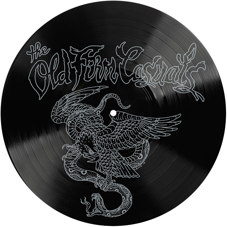 A black 12" vinyl record by The Old Firm Casuals, featuring a detailed winged serpent illustration and stylized silver silkscreen text on top, released by Rebellion Records.