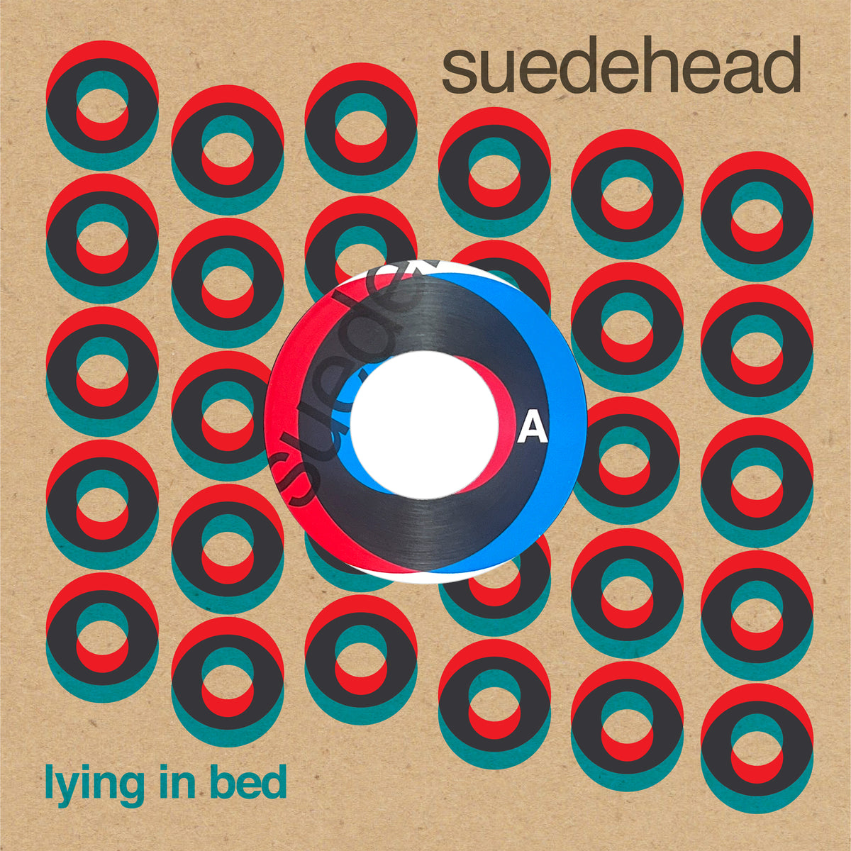 Cover art for the Suedehead single "Lying in Bed," released by Simba Records, showcases a grid of overlapping red, teal, and black rings on a tan background, partially obscured by a vinyl record. The band name "Suedehead" and the track title appear in the corners—a bold tribute to Northern Soul punks style.