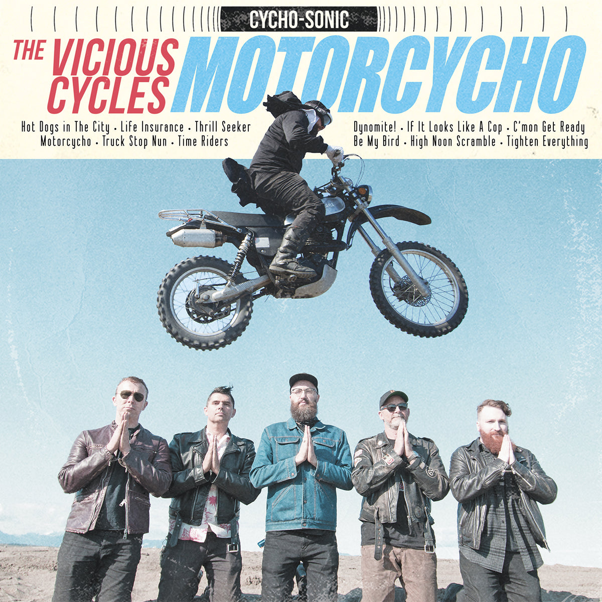 A motorcyclist leaps above four people with hands pressed together, capturing punk rock energy. Bold “The Vicious Cycles” text pops, evoking splatter vinyl album art and the brand’s rebellious style.