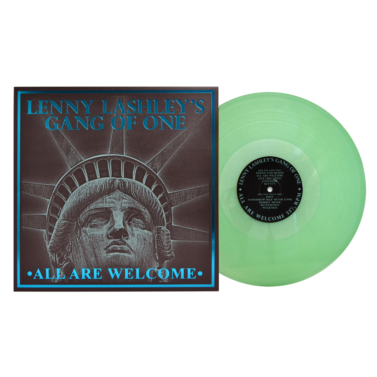 A green vinyl record by Lenny Lashley’s Gang Of One sits beside its album cover, which shows an illustrated Statue of Liberty and the album title “All Are Welcome,” celebrating Lenny Lashley’s punk roots.