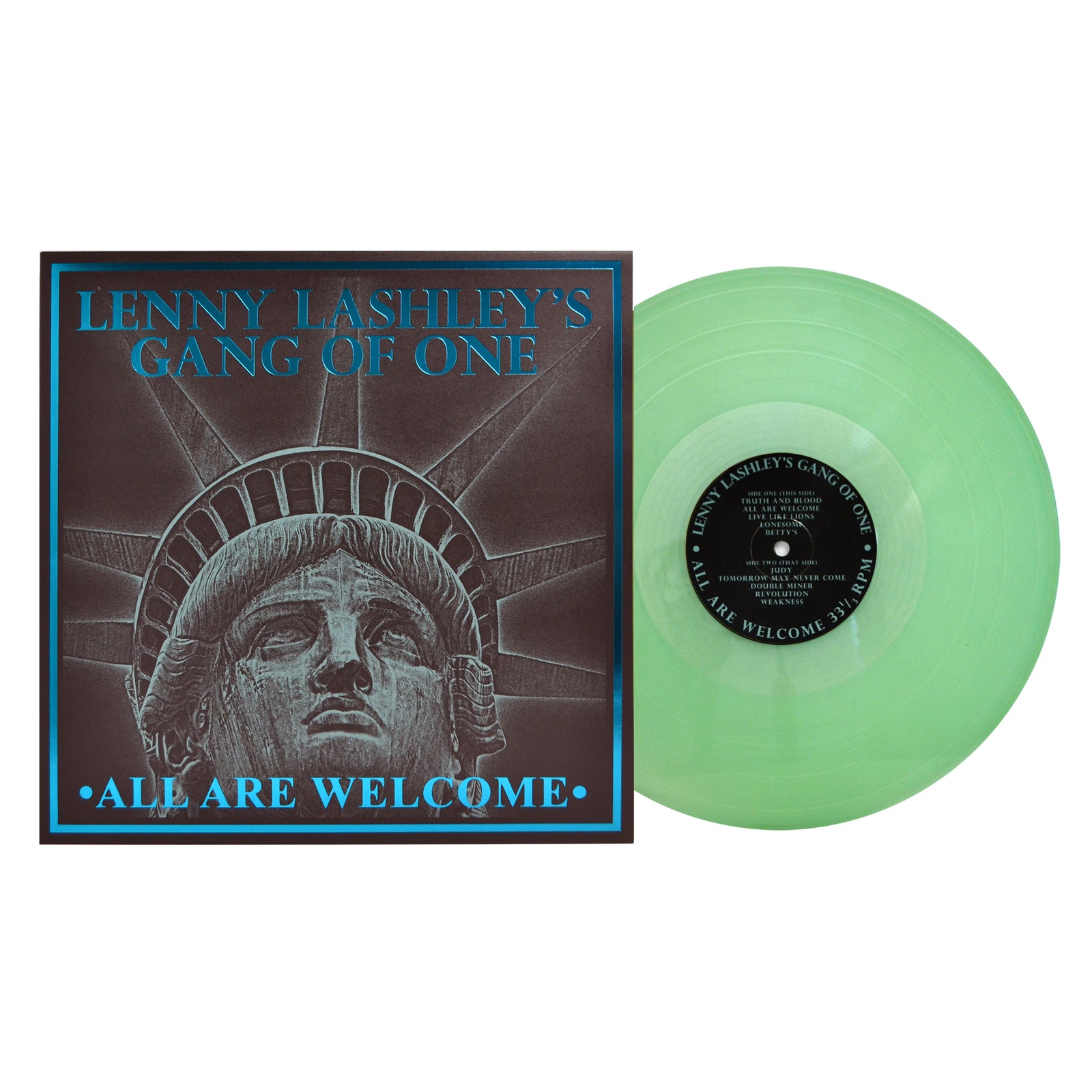A green vinyl record by Lenny Lashley’s Gang Of One sits beside its album cover, which shows an illustrated Statue of Liberty and the album title “All Are Welcome,” celebrating Lenny Lashley’s punk roots.