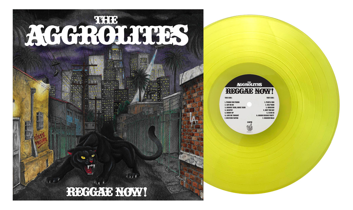 A yellow vinyl record by The Aggrolites sits next to the Reggae Now! album cover, which features a black panther prowling a nighttime urban alley with city buildings and palm trees, evoking Dirty Reggae vibes.