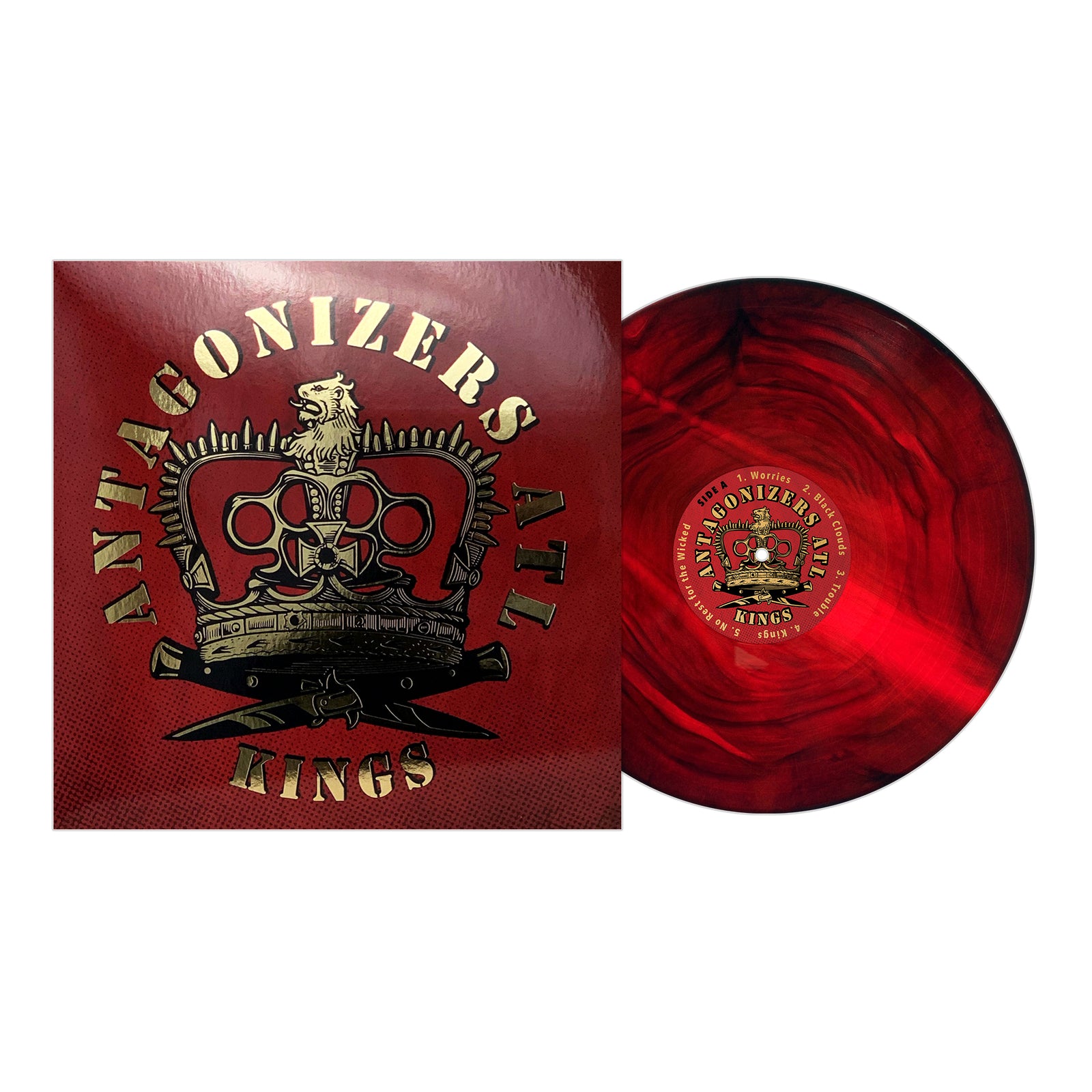 A red marbled vinyl punk album by Antagonizers ATL sits beside its cover, which displays a gold and black crowned lion emblem and KINGS in bold gold on glossy red—an iconic self-titled LP from Antagonizers ATL.