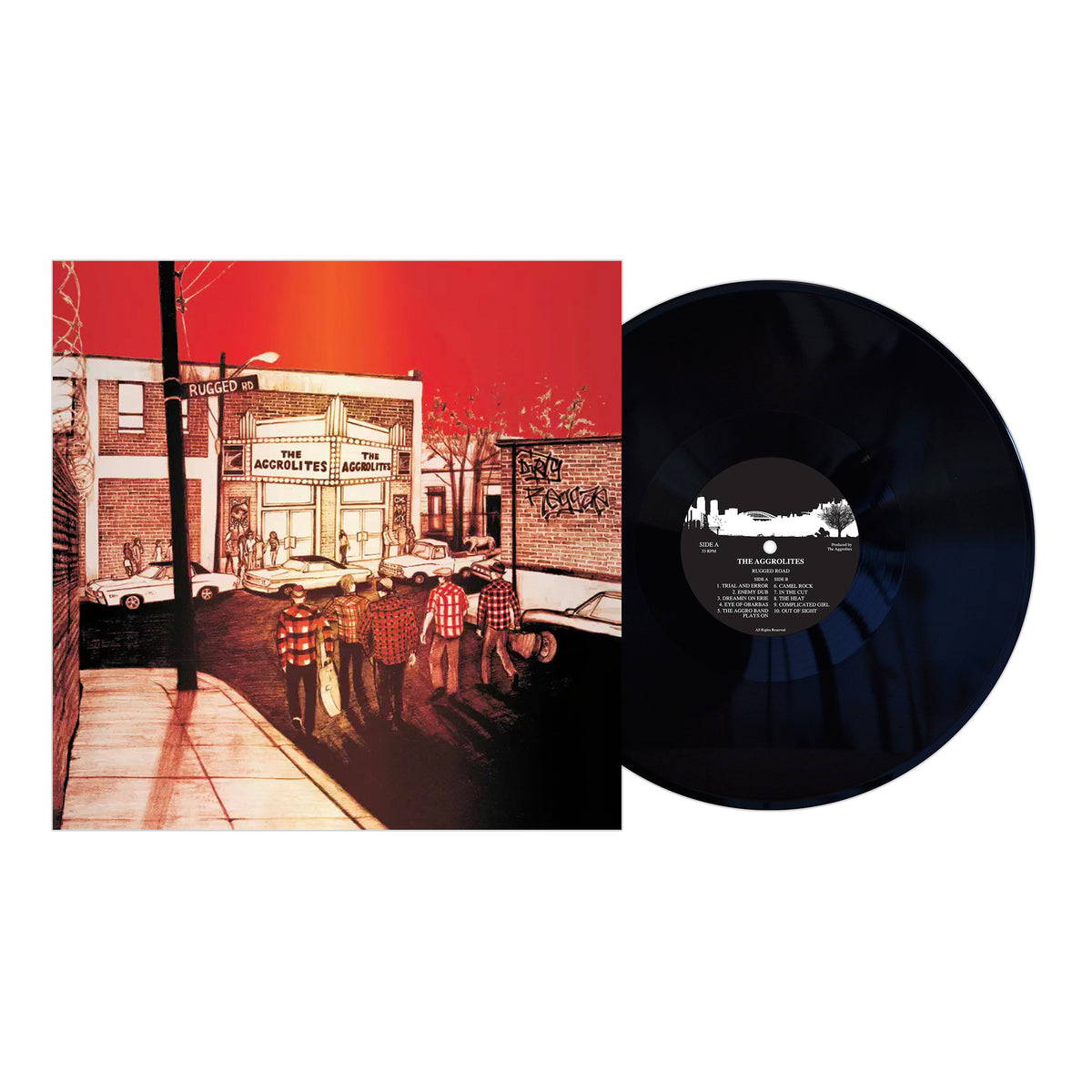 A remastered LP by The Aggrolites sits beside its album cover, depicting an urban street scene with six people in plaid shirts walking toward a building labeled Acid The Rugged Academy under a red-orange sky.