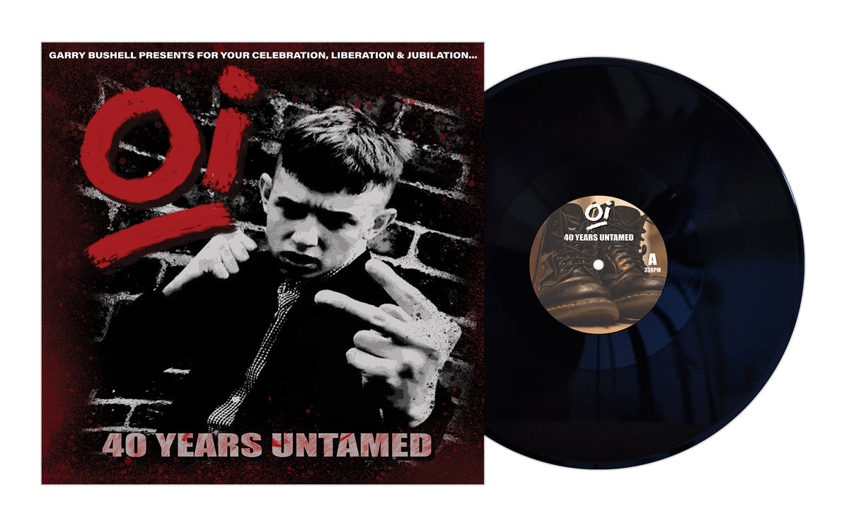 The Pirates Press Records album cover for Oi! 40 Years Untamed shows a young man in a suit making a defiant gesture against a brick wall, with bold red and white text and part of a vinyl record visible, celebrating working class punk.