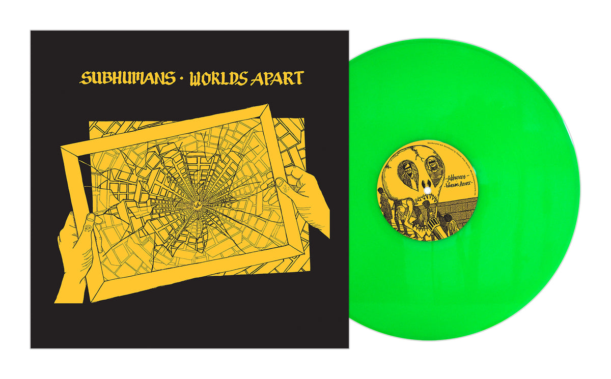 A green Subhumans vinyl record from their box set sits next to the Worlds Apart album cover, which displays anarcho punk artwork of yellow hands holding a cracked map on a black background.