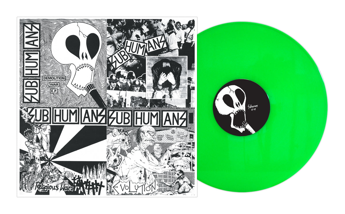 A bright green Subhumans vinyl record from the 1980-1986 box set sits next to a black-and-white anarcho punk album cover with collage art, including a large skull, distressed faces, and the words Subhumans and Evolution.