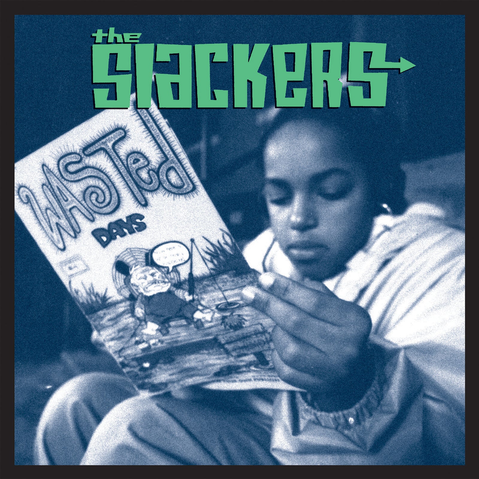 A young person reads a comic book titled Wasted Days while sitting indoors. The image is tinted blue, with The Slackers—the brand name—in bold green letters at the top, inspired by the iconic ska album cover.