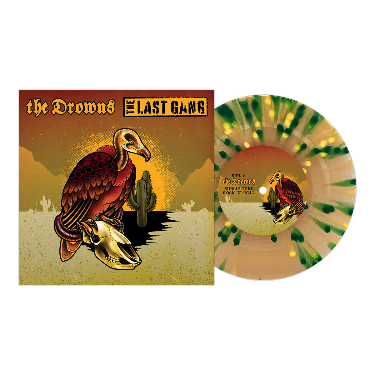 A split 7 vinyl with green and gold splatters from Pirates Press Records sits beside its cover art, which shows a vulture on a skull in a cactus-filled desert. The title, “The Drowns - The Last Gang,” suggests punk rock energy and bold lyrics.