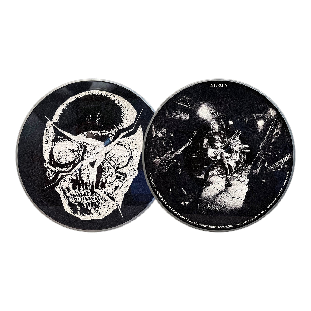 Two Mess vinyl records: one displays a cracked black-and-white skull, echoing classic Oi! streetpunk style; the other shows a live band playing guitars under dim lights. Both are set against a white background.