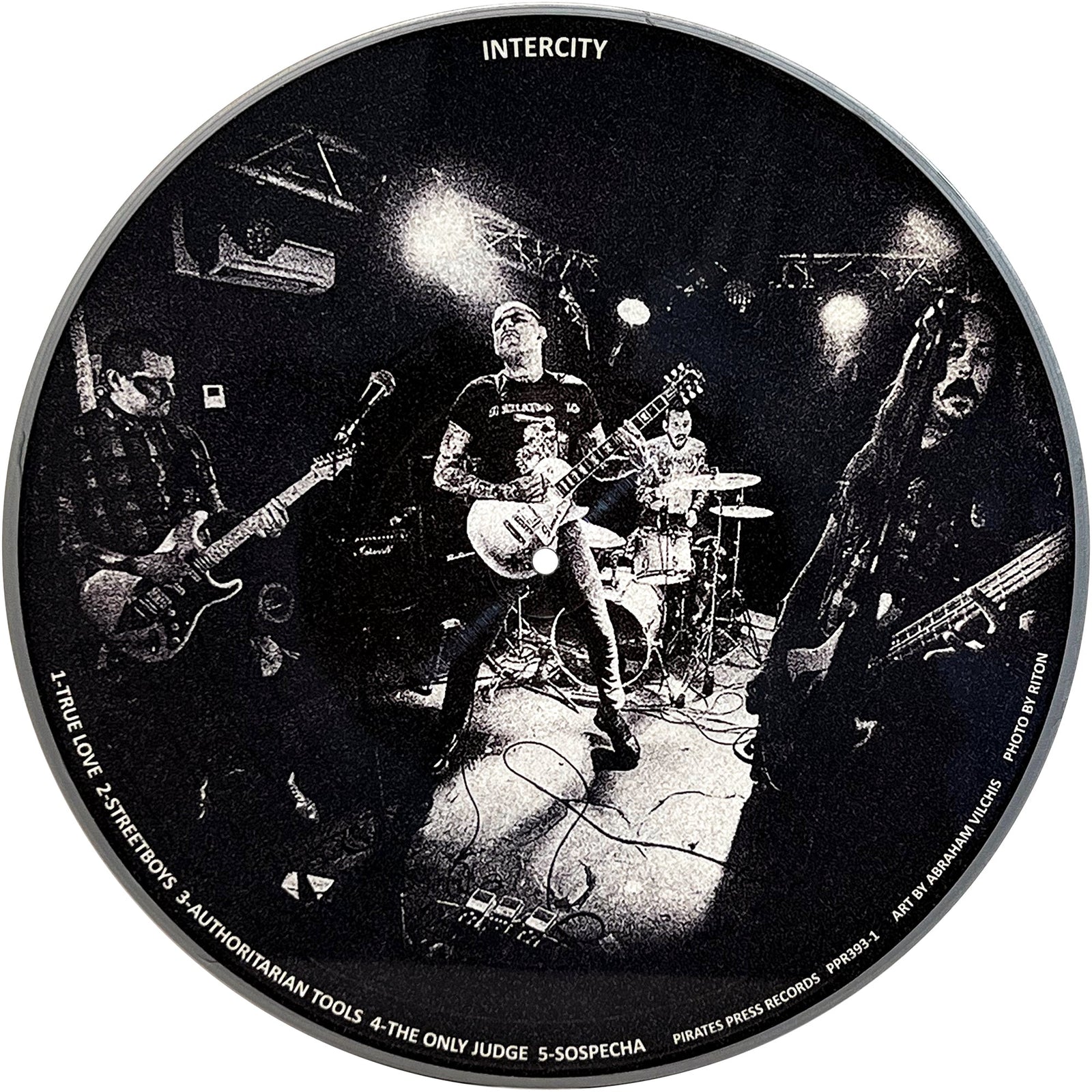 A black-and-white circular image shows Mess, a four-member streetpunk rock band, performing energetically on stage with guitars, drums, and microphones under bright lights. Band and album details are printed around the border.