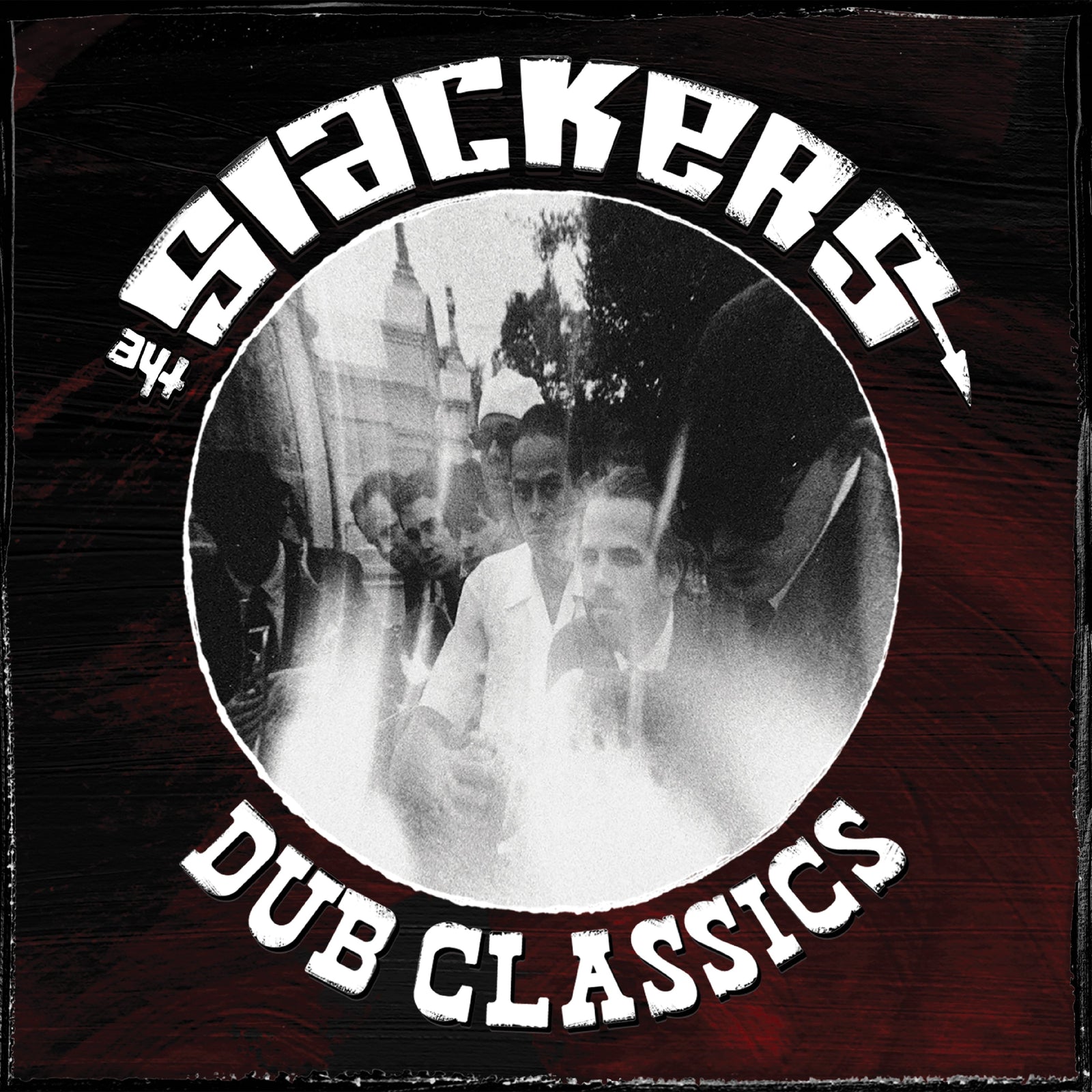Album cover for The Slackers’ Dub Classics, inspired by Jamaican music, with a black and white photo of people in suits and bold white distorted text curving over a red and black textured background.