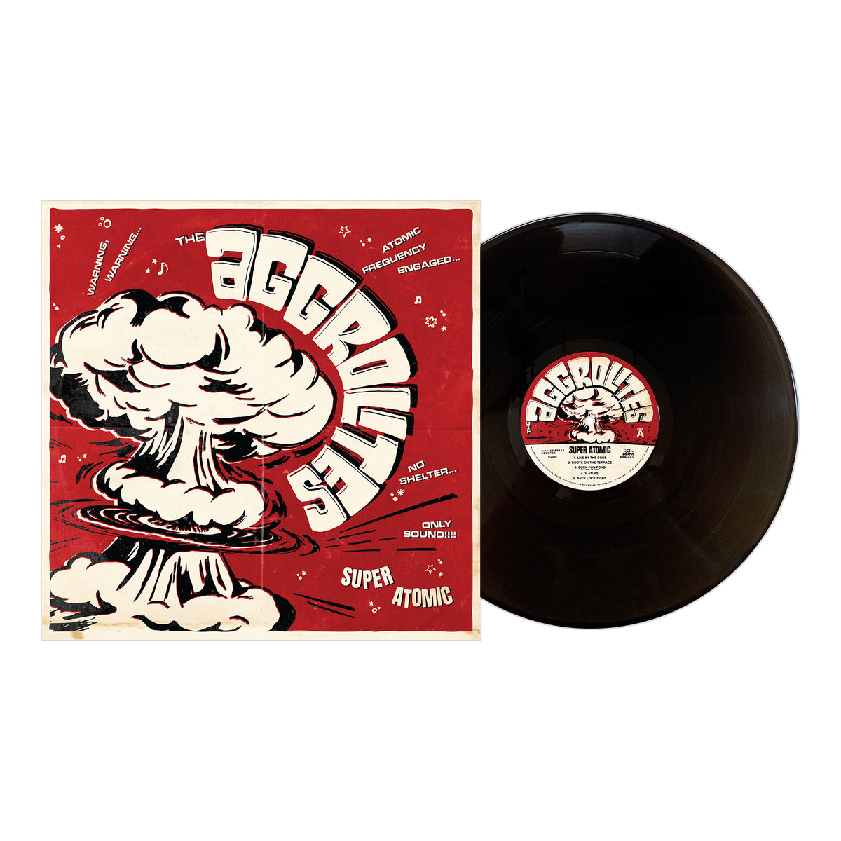 A black vinyl record by The Aggrolites lies next to a red and white album cover featuring a cartoon atomic explosion, bold "The Aggrolites" text, and phrases such as Dirty Reggae, Super Atomic, and No Shelter.