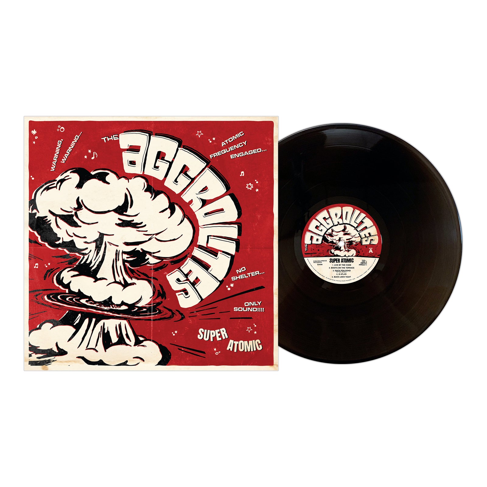 A black vinyl record by The Aggrolites lies next to a red and white album cover featuring a cartoon atomic explosion, bold "The Aggrolites" text, and phrases such as Dirty Reggae, Super Atomic, and No Shelter.