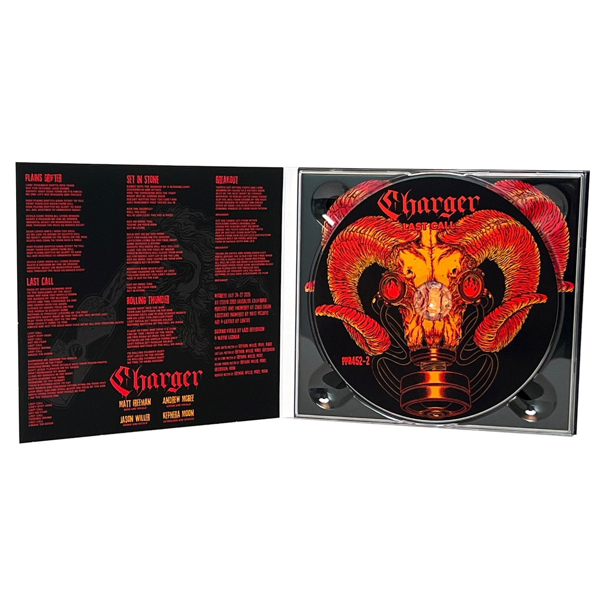 An open CD case for Charger’s “Warhorse” album—released by the brand Charger—displays red song lyrics on the left and a CD on the right, featuring fiery, stylized ram horns and a gas mask illustration set against a black background.