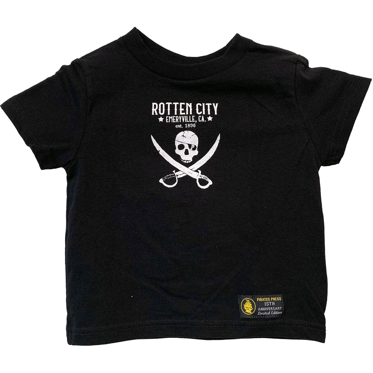 A black Pirates Press Records toddler T-shirt with the Rotten City design: white skull above crossed swords and ROTTEN CITY EMERYVILLE, CA. Est. 1896.” Printed on Rabbit Skins #3301T, small yellow patch at the hem.