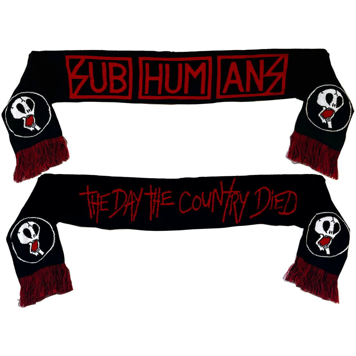 Two black Subhumans scarves with red fringe: one has SUB HUM ANS in red block letters, the other THE DAY THE COUNTRY DIED in red script. Both feature the Subhumans skull logo on each side.