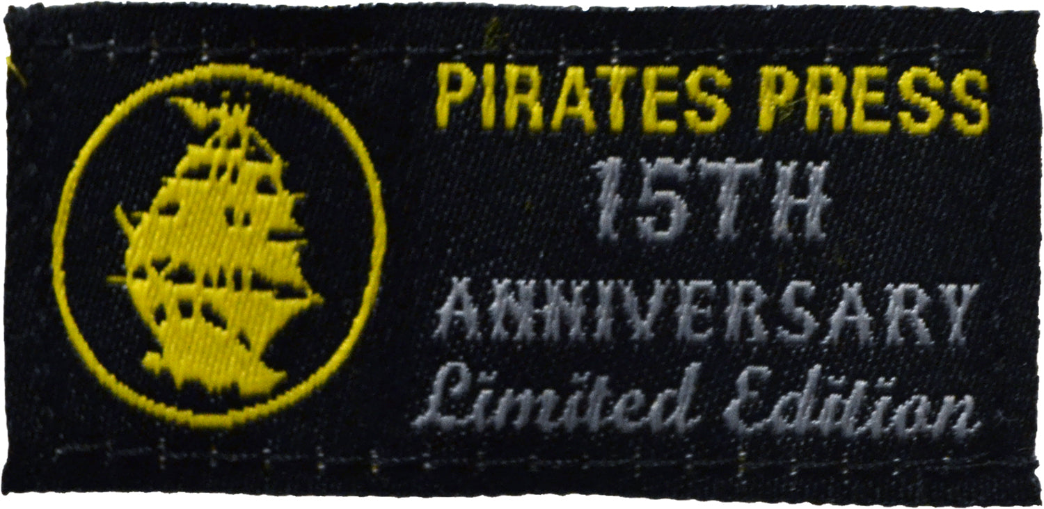 A black patch featuring a yellow ship silhouette and yellow/white text: PIRATES PRESS RECORDS 15TH ANNIVERSARY Limited Edition—perfect to pair with your favorite Pirates Press Records youth shirt.