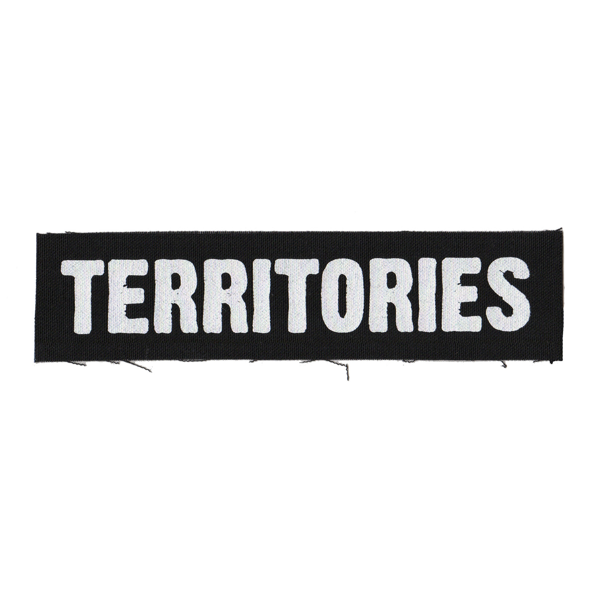 A black cloth patch by Territories, screenprinted with the brand name in bold, white, uppercase letters.