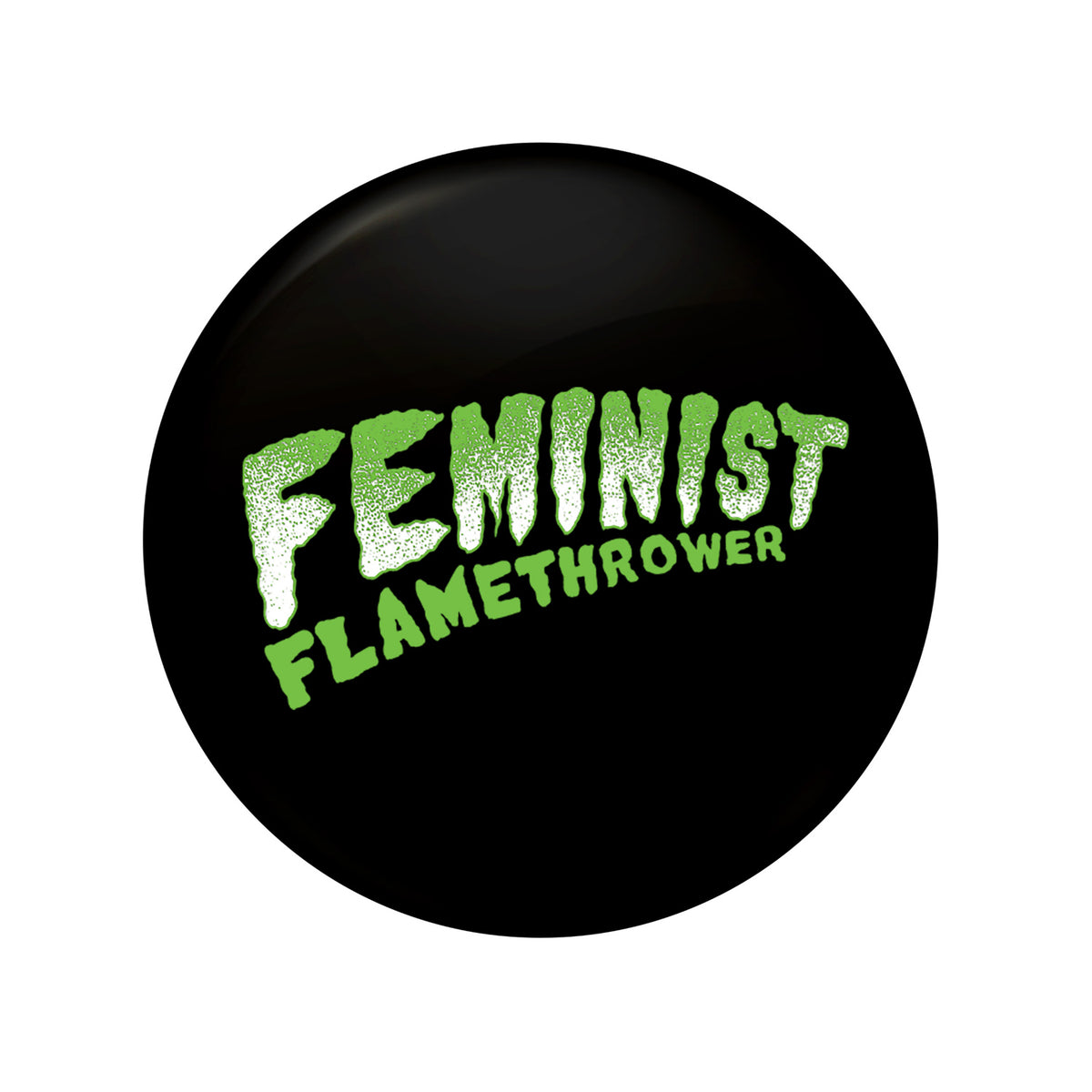 A 1&quot; black circular button featuring &quot;Feminist Flamethrower&quot; in bold, textured green letters—a perfect accessory for any fan of The Drowns.